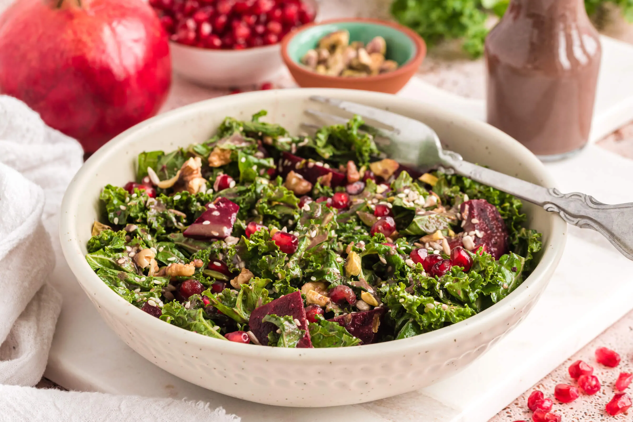 Creamy Kale Salad with Pomegranate and Toasted Hazelnuts