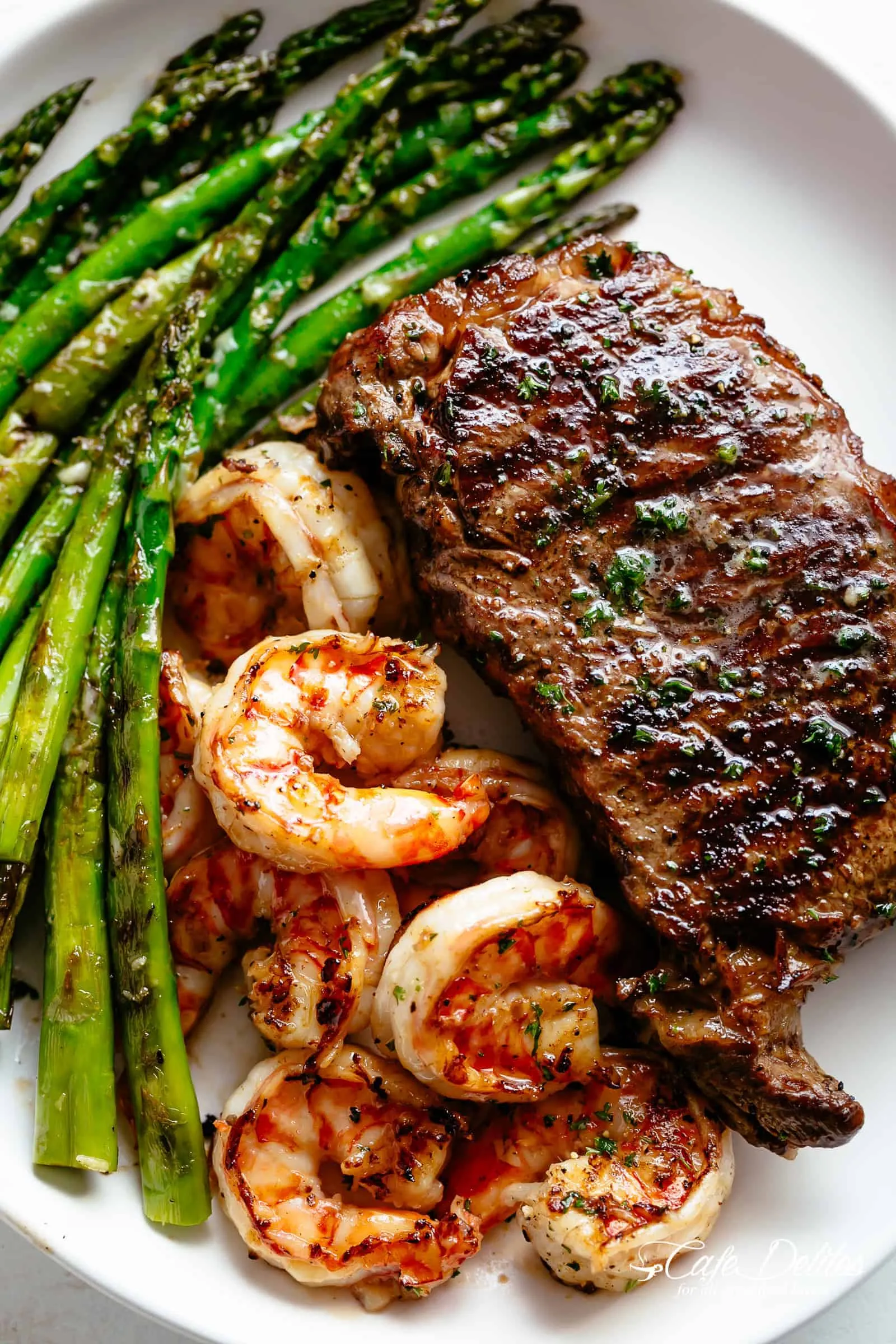 Grilled Steak and Shrimp with Black Garlic Butter