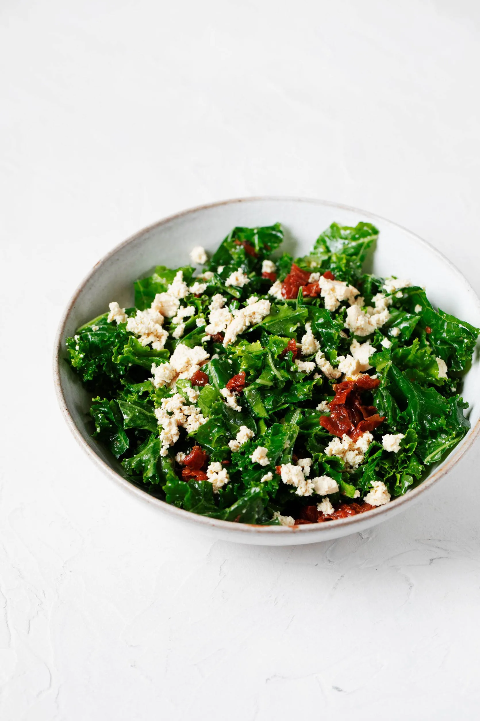 Kale Salad with Tofu Feta, Sun Dried Tomatoes, and Lemon Hemp Dressing