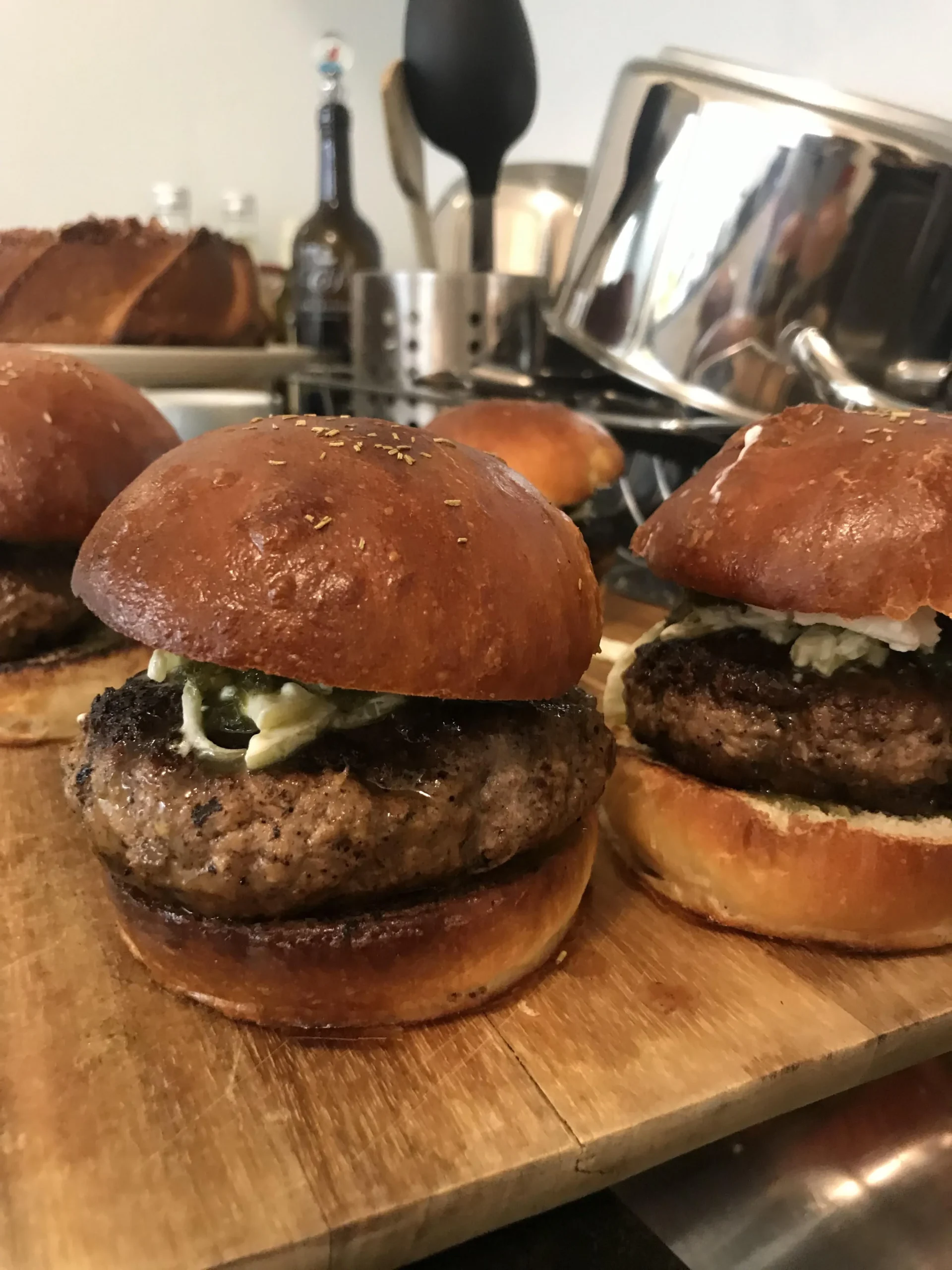 Lamb Burgers with Bacon, Tomato Jam, Fennel Slaw, and Goat Cheese