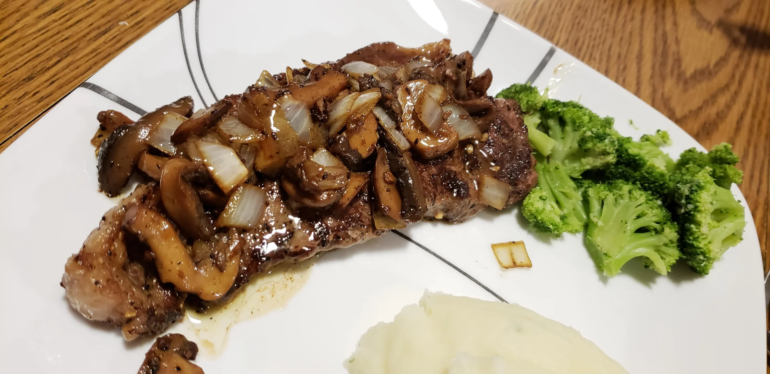New York Strip Steak with Cognac Creamed Mushrooms