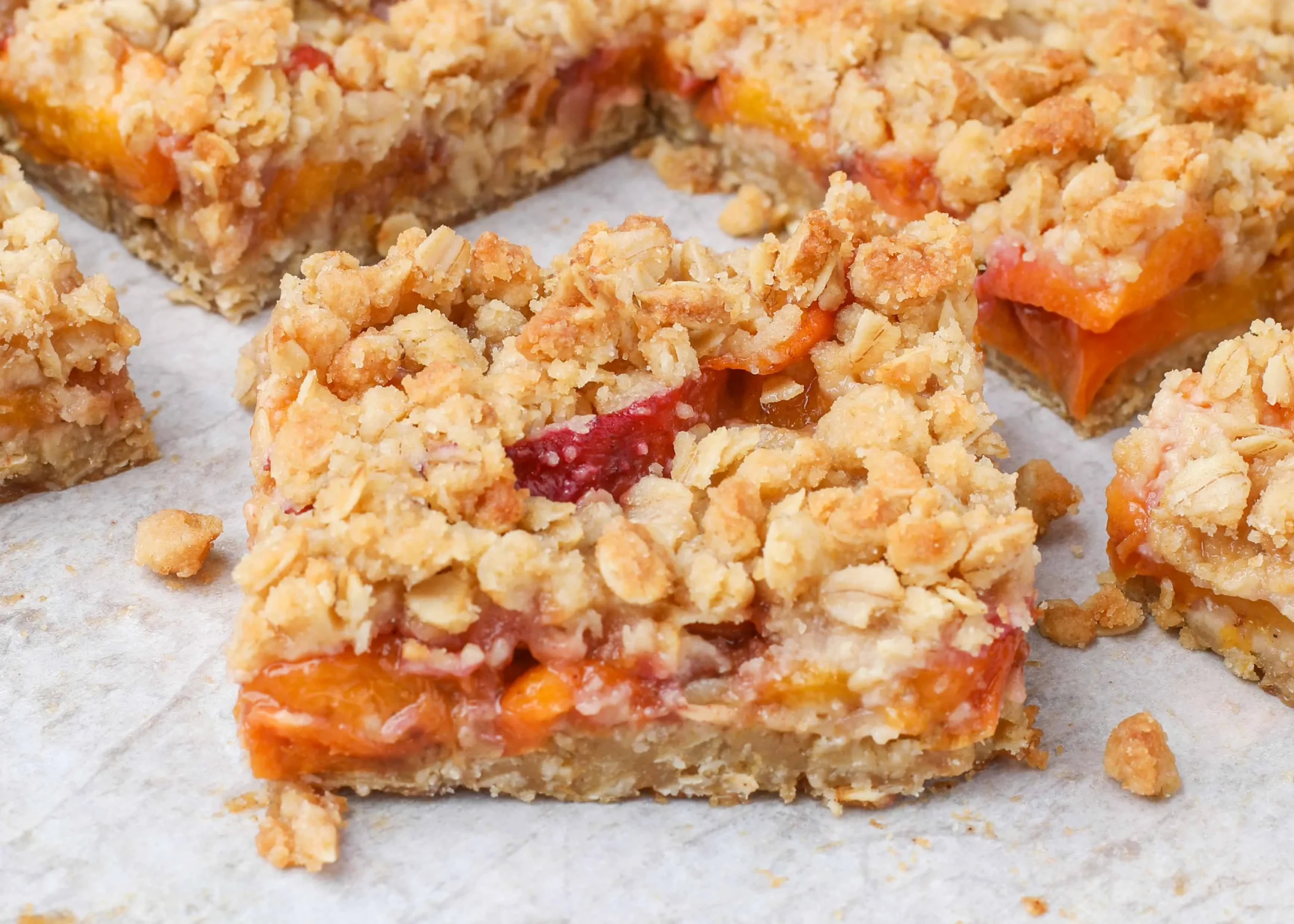 Peach Cinnamon Oatmeal Cheesecake Bars