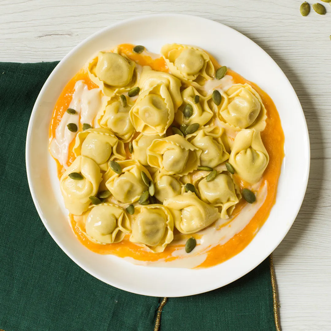 Ricotta Asiago Tortellini with Spinach and Garlic Scapes Pesto