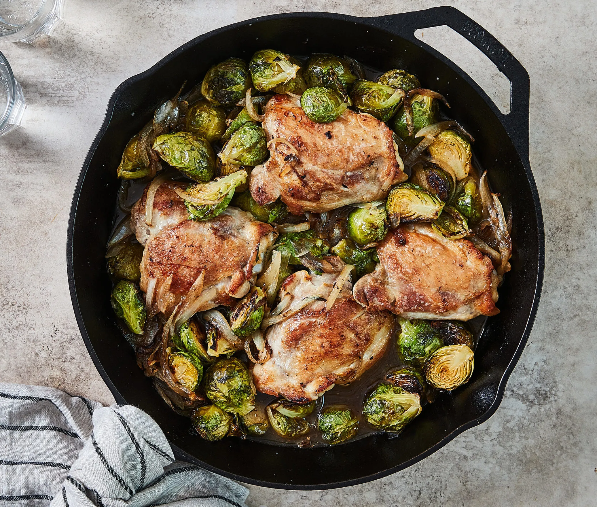 Single Skillet Chicken Thighs with Bacon Brussels Sprouts and Apple Jus