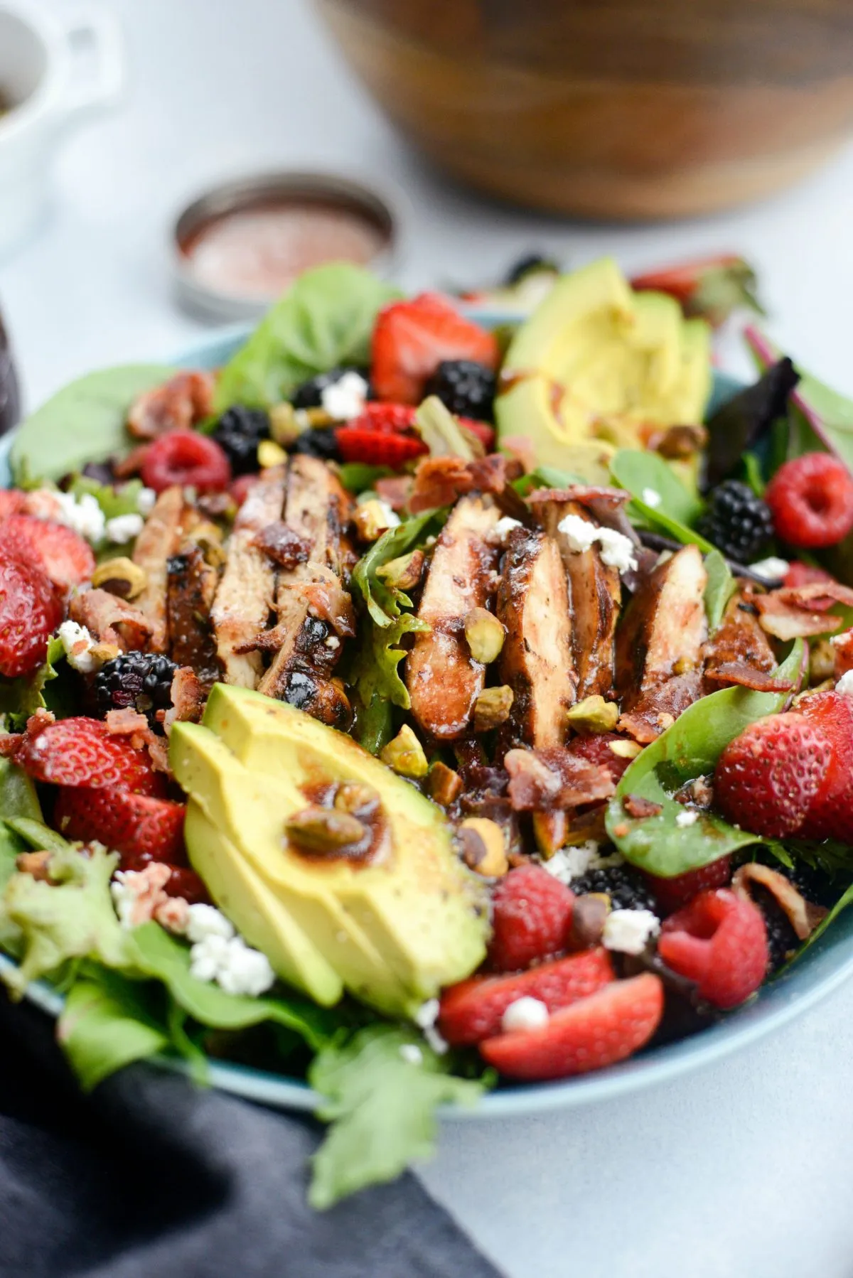Spring Green Salad with Kiwi, Raspberries, and Date Balsamic Vinaigrette