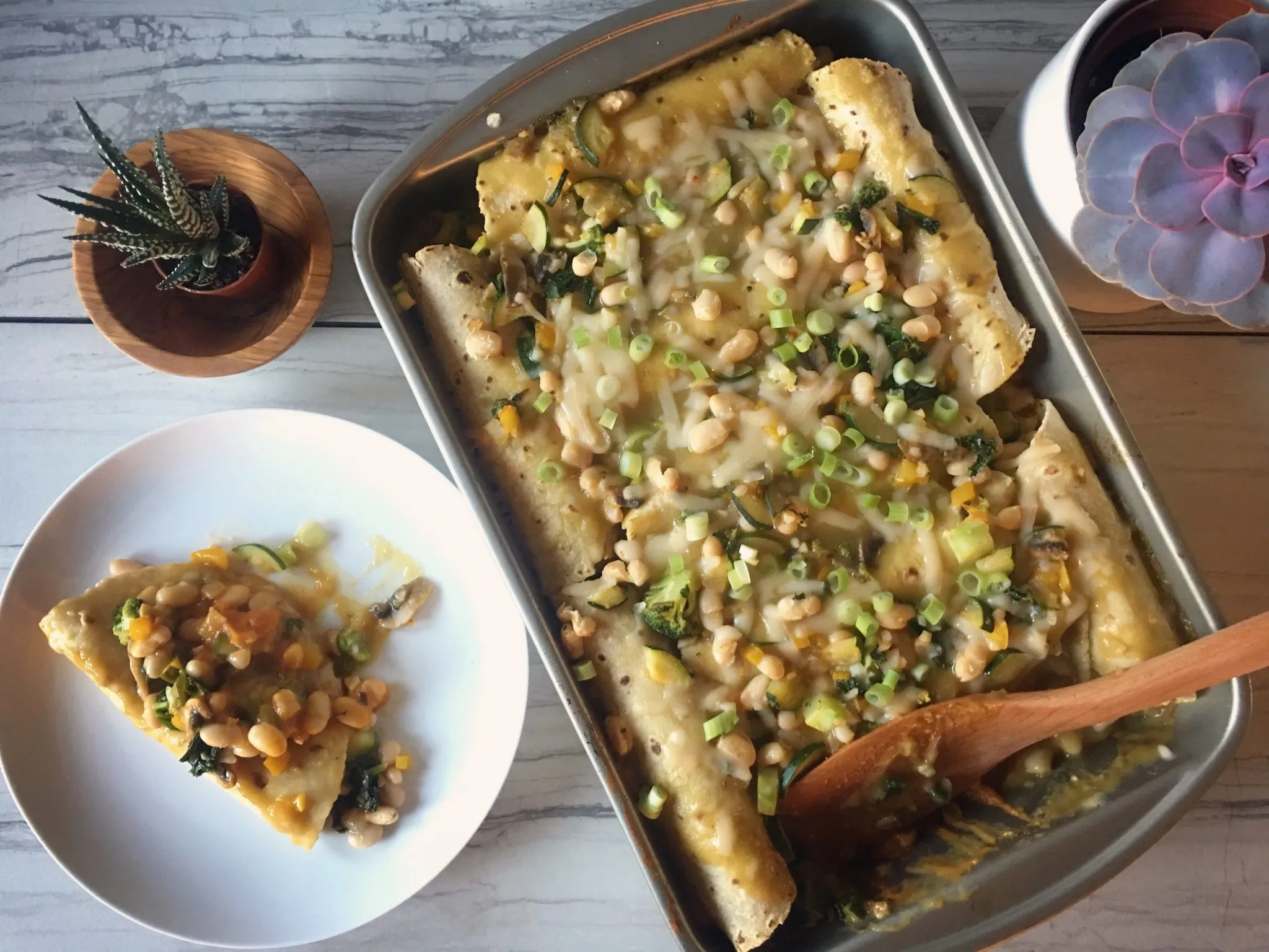 White Bean Enchiladas Verdes with Roasted Corn and Zucchini