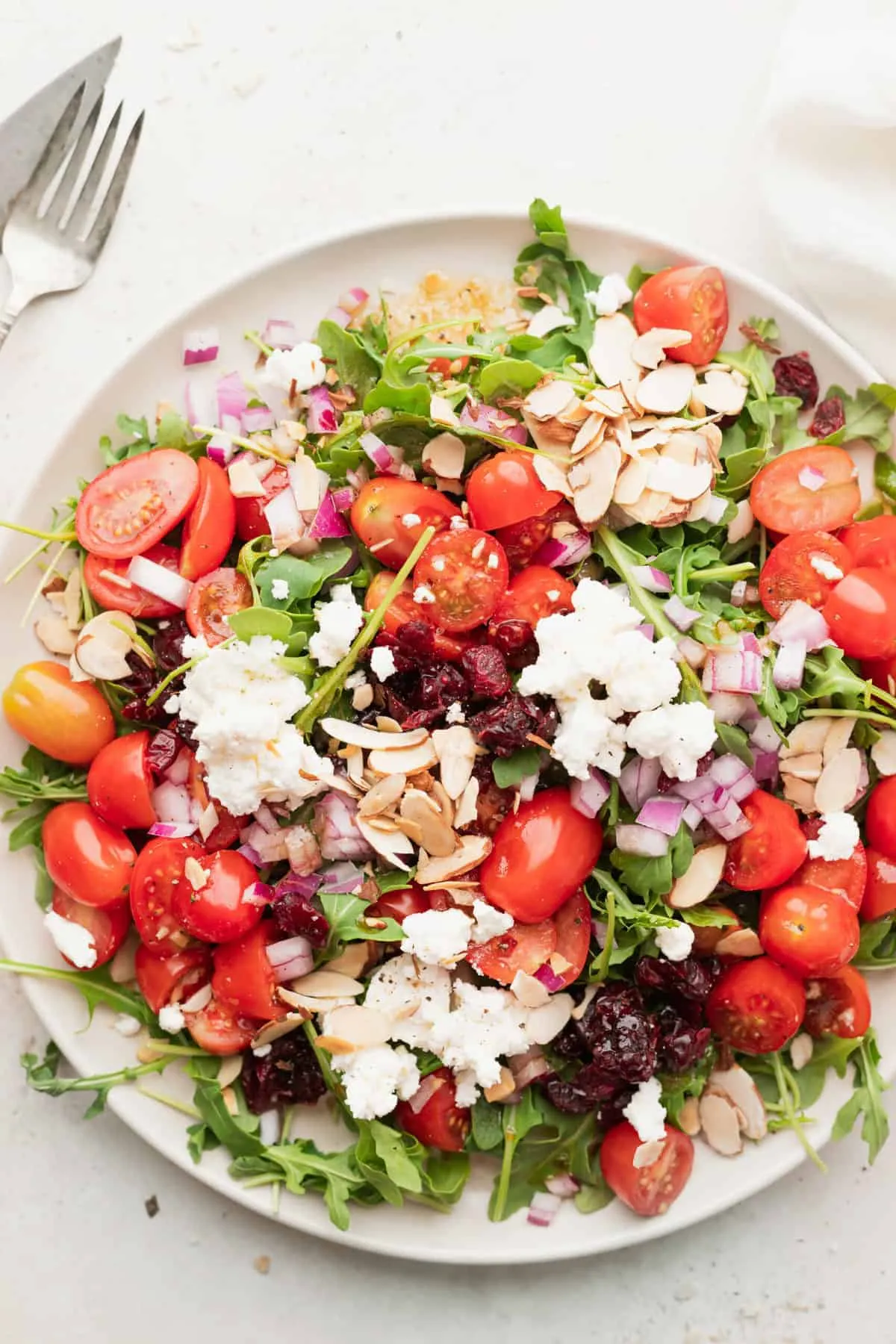 arugula salad with apples almonds quinoa and goat cheese