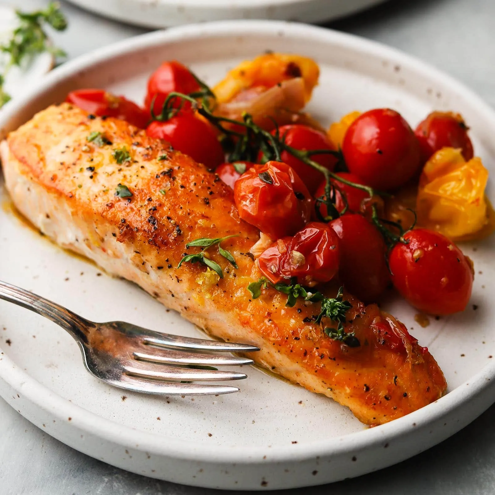 basil butter roasted salmon with burst tomatoes